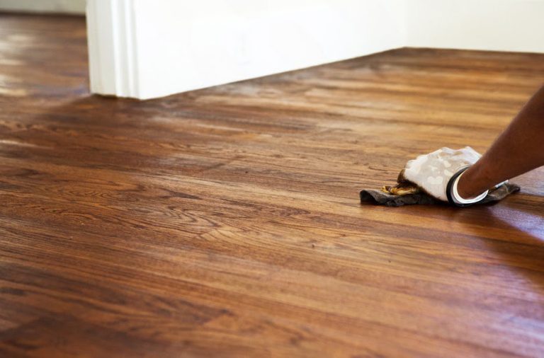 Restaining engineered wood floor without sanding by applying finish to the surface