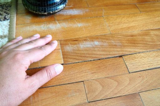 Hardwood floor gaps between planks showing seasonal or structural floor movement