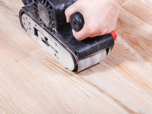 Aggressive sanding on engineered hardwood floor showing why heavy removal can be too risky for thin veneer layers