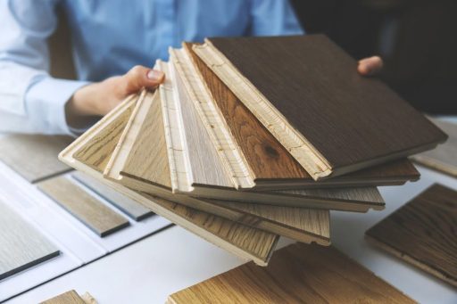 Hardwood flooring samples showing different wood tones and surface styles for interior selection