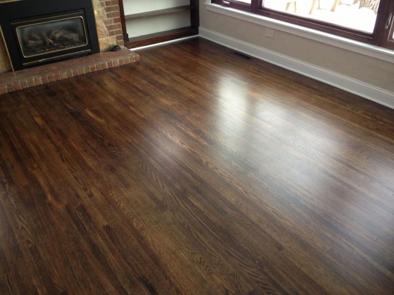 Dark stained hardwood floor showing a richer deeper color and even finish throughout the room