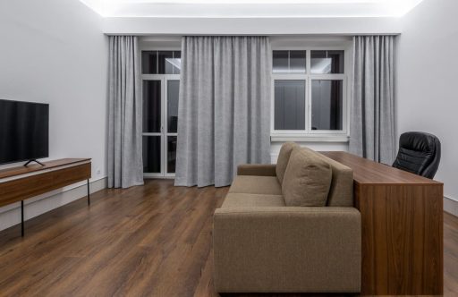 Engineered hardwood floor after screen and recoat showing a renewed finish without full sanding