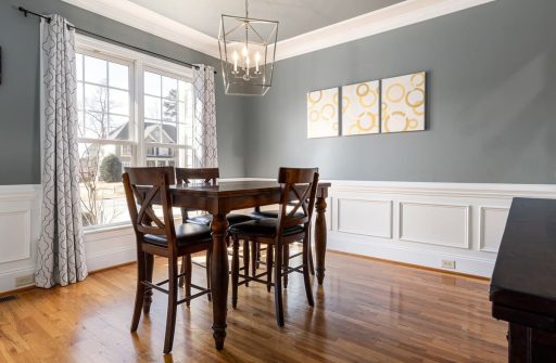 Engineered hardwood floor in dining room showing a finished surface that may be a good candidate for screen and recoat