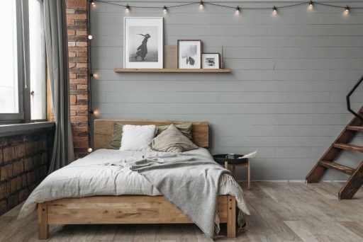 Refinished hardwood floor with a protective finish in a modern bedroom