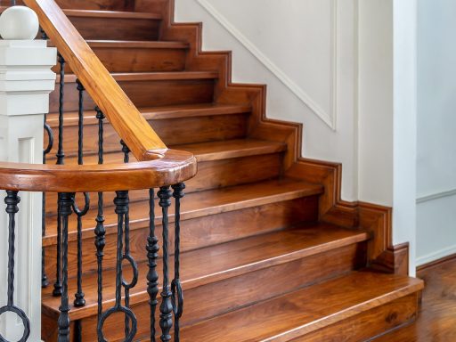 Refinished wood stairs with a smooth finish and rich natural wood tone